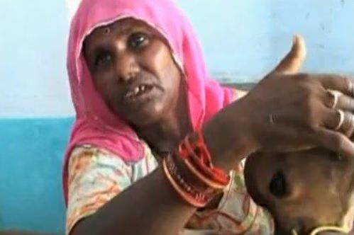 Indian Woman Breastfeed Calf Cow 01-2010-09-01.jpg