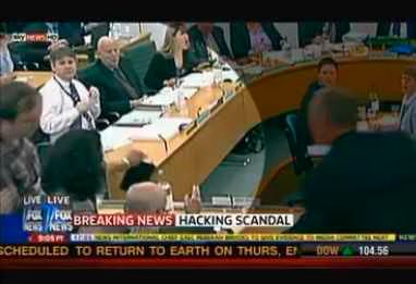 Rupert Murdoch attacked with foam pie in the face during testimony