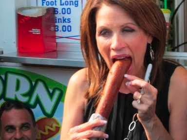 Michele Bachmann eats a footlong corndog at Iowa State Fair