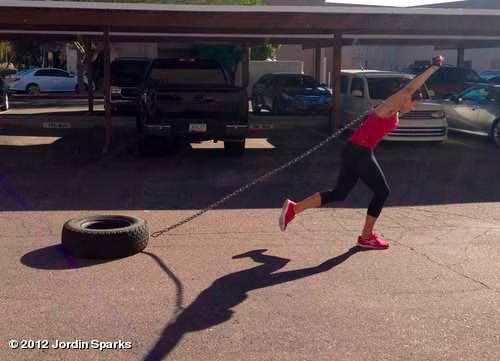 Jordin Sparks pulling a tire