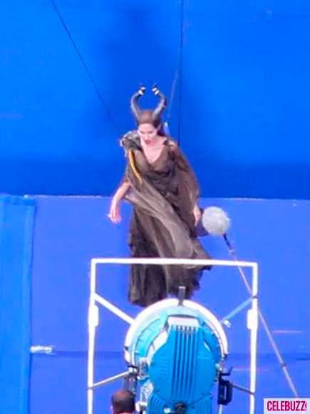 Angelina Jolie dangles from a crane on set of  Maleficent  Photo