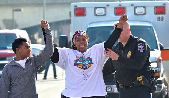Police Lt. Aubrey Gregory is Internet's new hero after helping woman finish 10K race (PHOTOS)