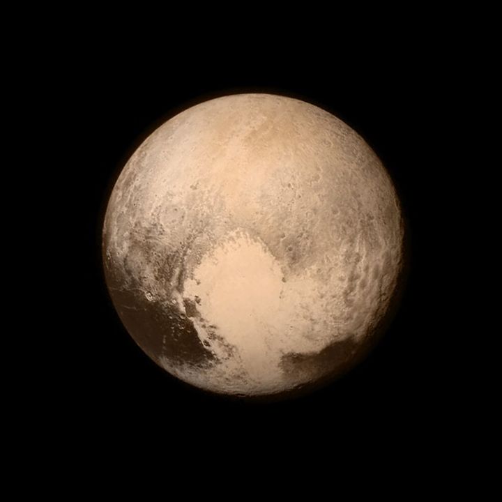 Pluto nearly fills the frame in this image from the Long Range Reconnaissance Imager (LORRI) aboard NASA’s New Horizons spacecraft, taken on July 13, 2015 when the spacecraft was 476,000 miles (768,000 kilometers) from the surface. This is the last and most detailed image sent to Earth before the spacecraft’s closest approach to Pluto on July 14. The color image has been combined with lower-resolution color information from the Ralph instrument that was acquired earlier on July 13. This view is dominated by the large, bright feature informally named the “heart,” which measures approximately 1,000 miles (1,600 kilometers) across. The heart borders darker equatorial terrains, and the mottled terrain to its east (right) are complex. However, even at this resolution, much of the heart’s interior appears remarkably featureless—possibly a sign of ongoing geologic processes. Credits: NASA/APL/SwRI