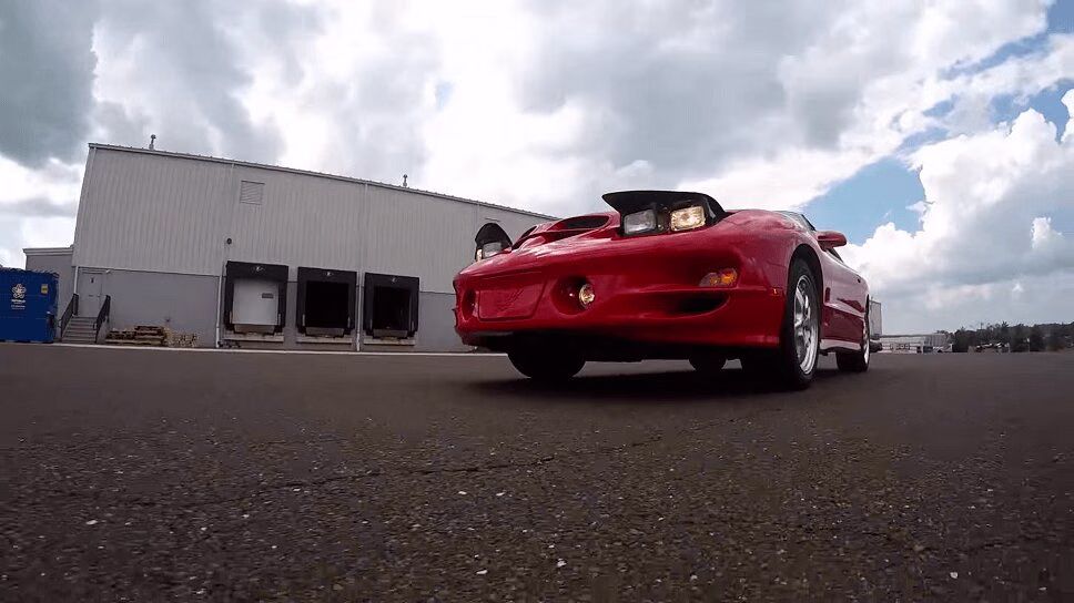 Insane Car Reviewer Digs Into a 2001 Pontiac Trans-Am for Some Crazy Reason (VIDEO)