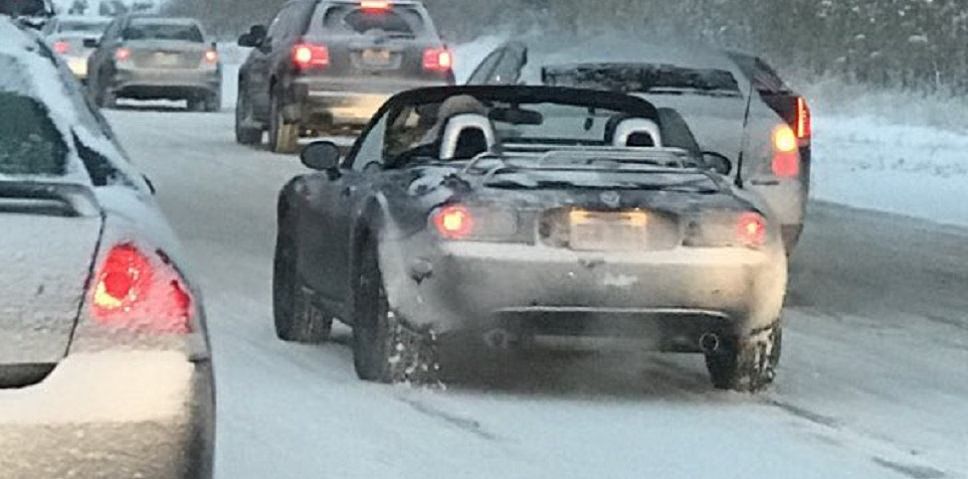 Insane Driver Pilots Mazda Miata Through Snowstorm - With the Top Down!